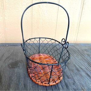 Small metal basket with woven bottom